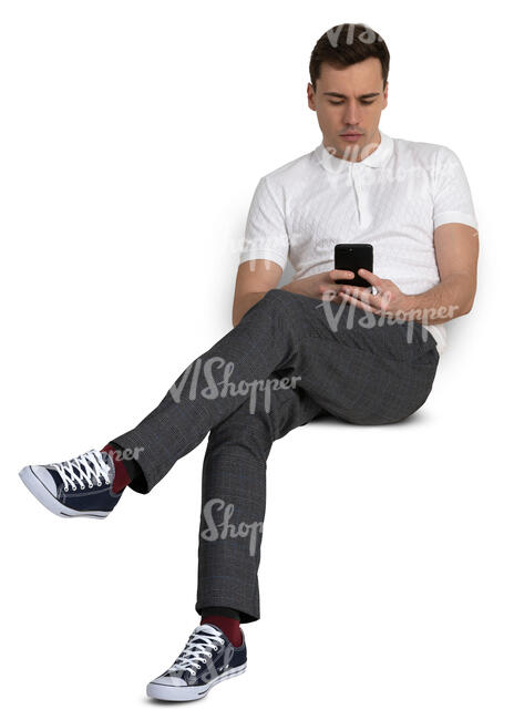 man sitting casually and checking his phone