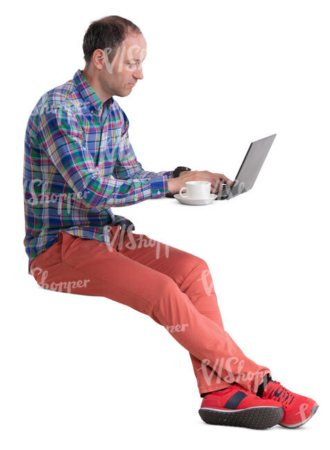 man sitting in a cafe and working with laptop