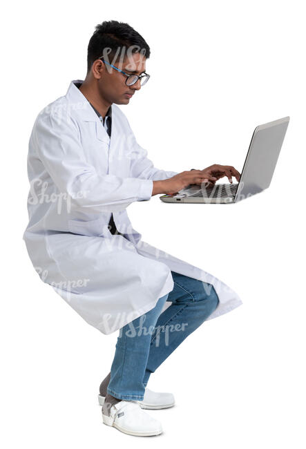 young scientist working at a table with a laptop