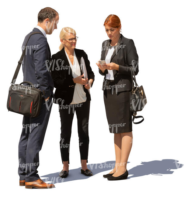 group of three business people standing outside