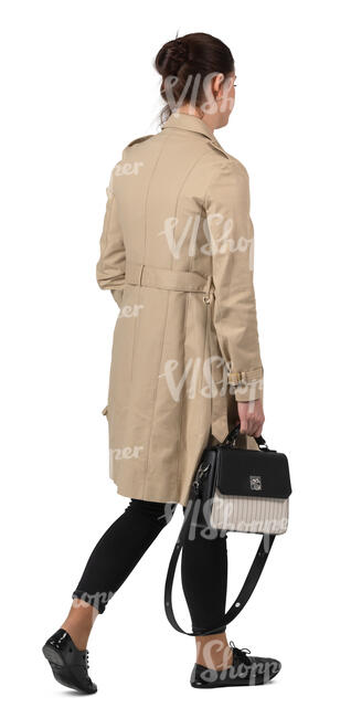 woman in a light overcoat walking