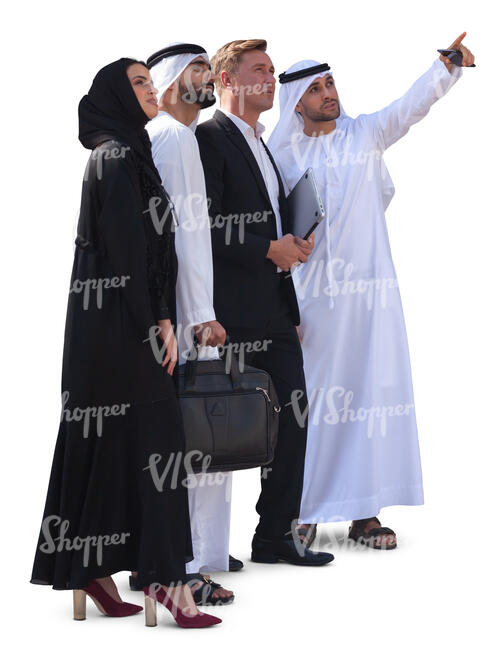 group of businesspeople in emirati standing and looking at smth