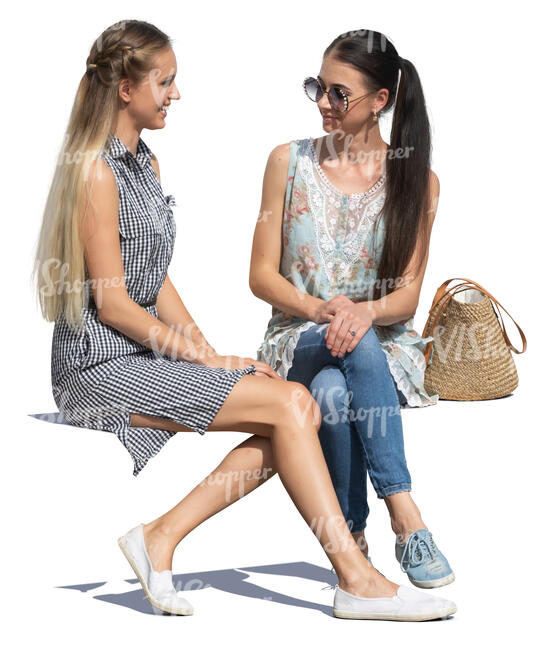 two women sitting and talking