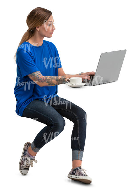 woman with a laptop sitting in a cafe