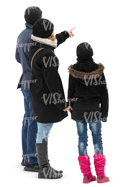 family in wintercoats standing and looking at smth