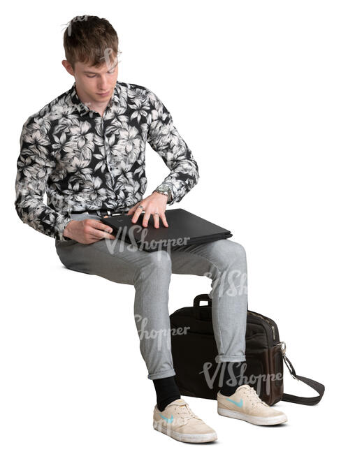 young man sitting and opening his laptop