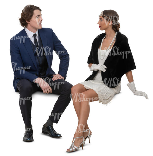 man and woman sitting and talking at a party
