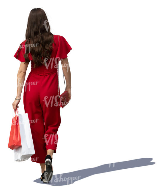 woman in a red jumpsuit walking shopping bags in hand