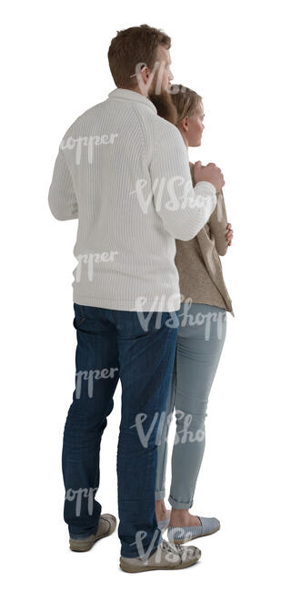 couple standing by the window and looking out