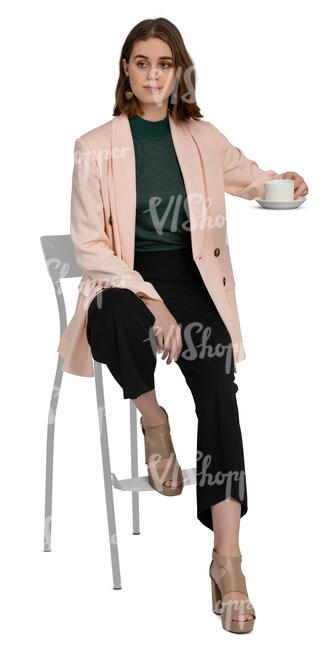 woman sitting at a barstool and drinking coffee