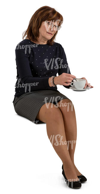 older woman sitting in a cafe and drinking coffee