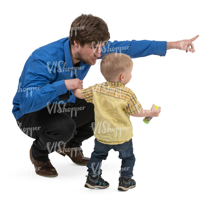 father squatting and talking to his little son