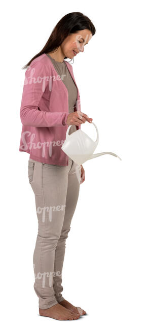 woman standing and watering plants