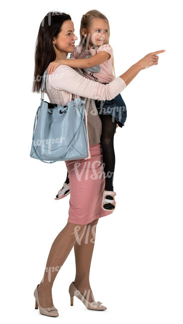 woman holding a child standing and pointing at smth