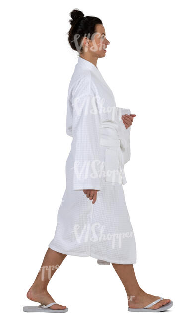 woman in a white bathrobe walking