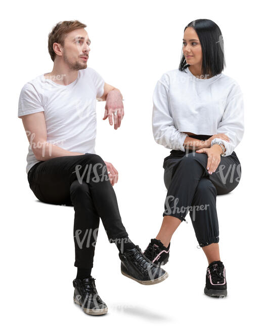 man and woman sitting and talking