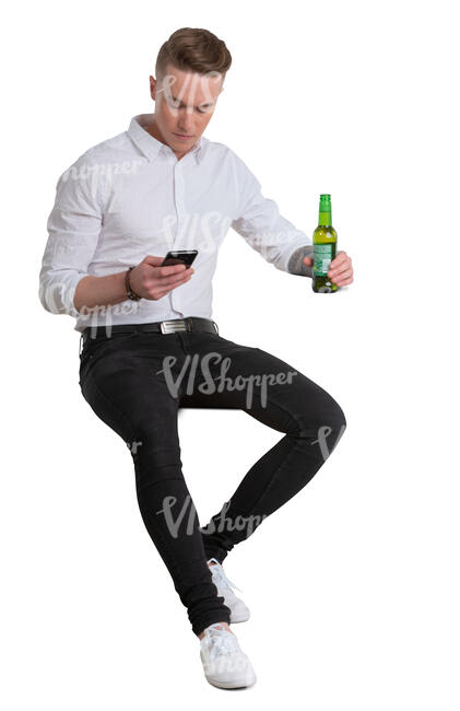 young man sitting in a bar and drinking beer