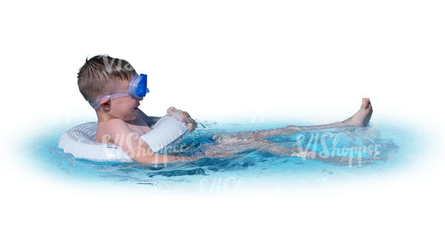 little boy swimming with a swim ring