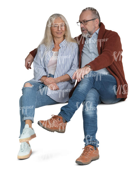 elderly couple sitting and talking