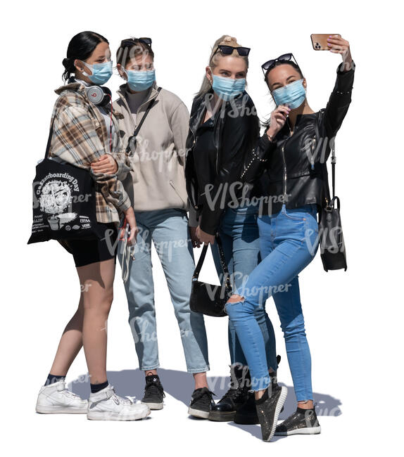 four girls with face masks standing and taking a selfie