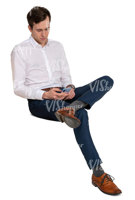 man sitting and browsing his phone