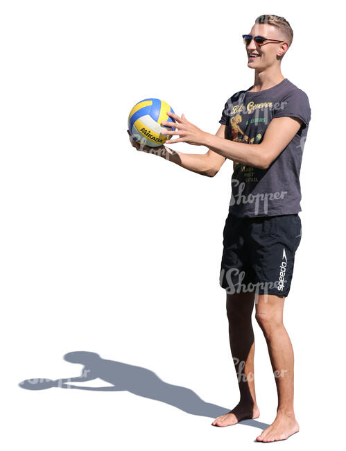 man holding a ball and smiling