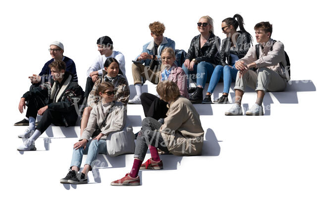 group of young people sitting on the stairs and talking