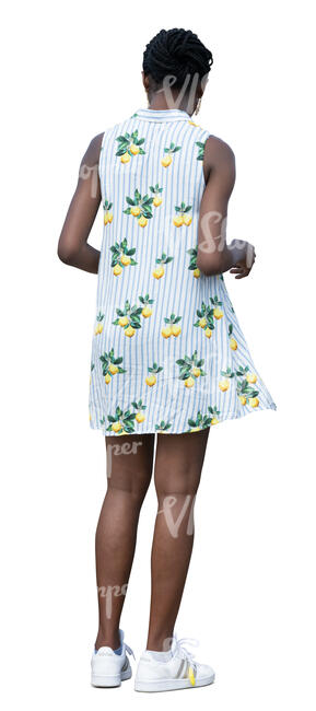 woman in a mini summer dress standing