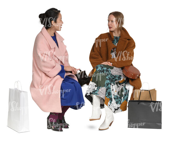 cut out two women in overcoats sitting and talking