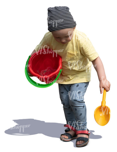 cut out little boy with a toy bucket playing