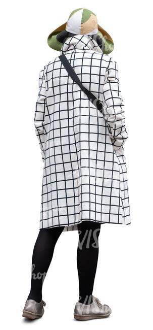cut out woman with an overcoat and large hat standing