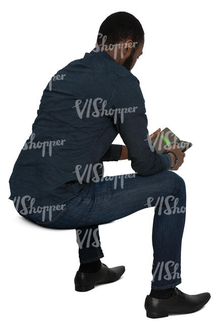 cut out black man sitting and checking his phone