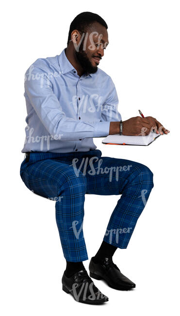 cut out man sitting at a desk and writing notes