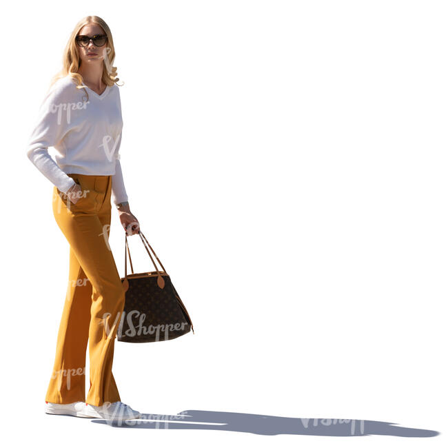 cut out young sidelit woman in a smart casual outfit walking