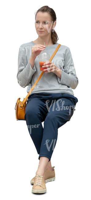 cut out woman sitting and sipping some juice