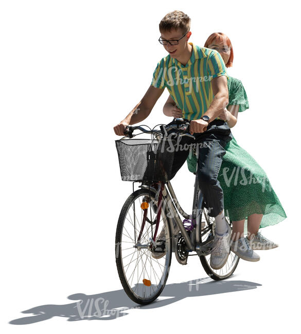 cut out young backlit couple riding a bicycle