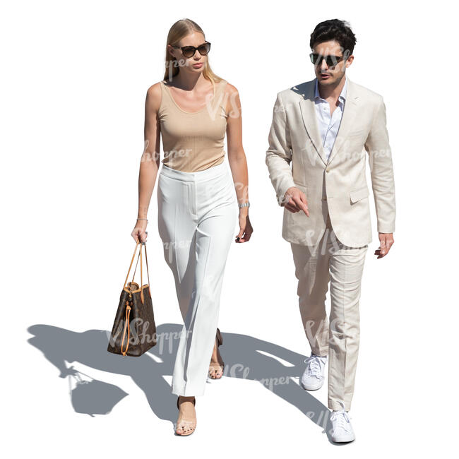 cut out man and woman in light coloured summer outfits walking seen from above