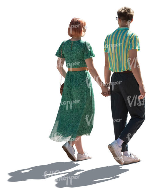 cut out young backlit couple walking hand in hand