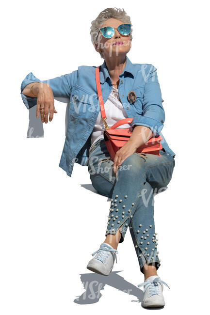 cut out trendy elderly woman sitting on a chair and relaxing