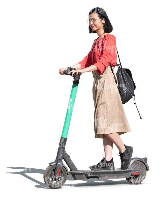 cut out young asian woman riding an electric scooter