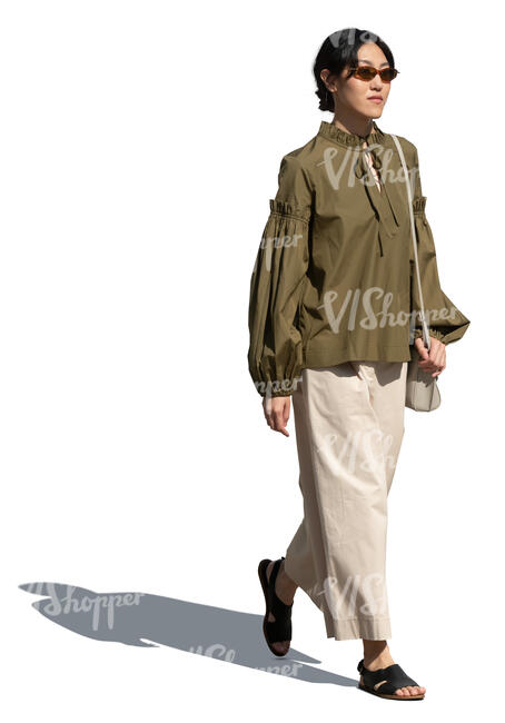 cut out asian woman walking on a sunny day