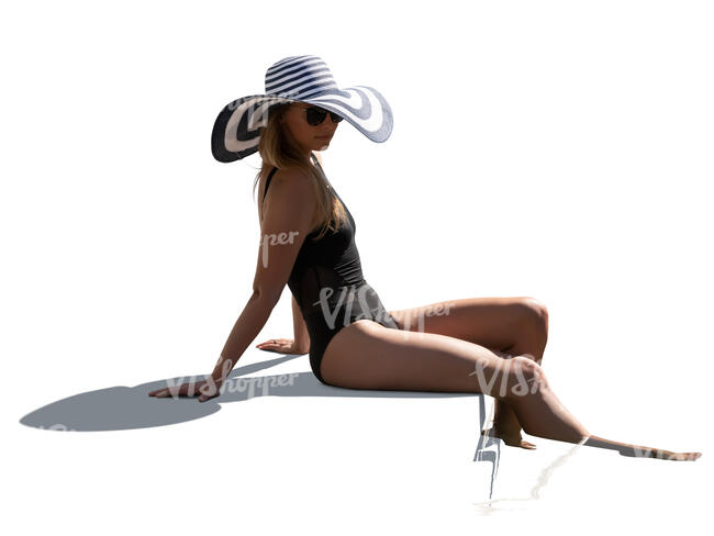 cut out woman with a big hat sitting on the edge of a pool