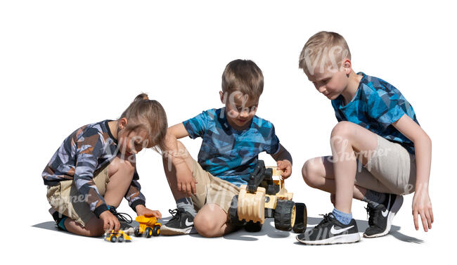 three cut out boys playing with toy cars