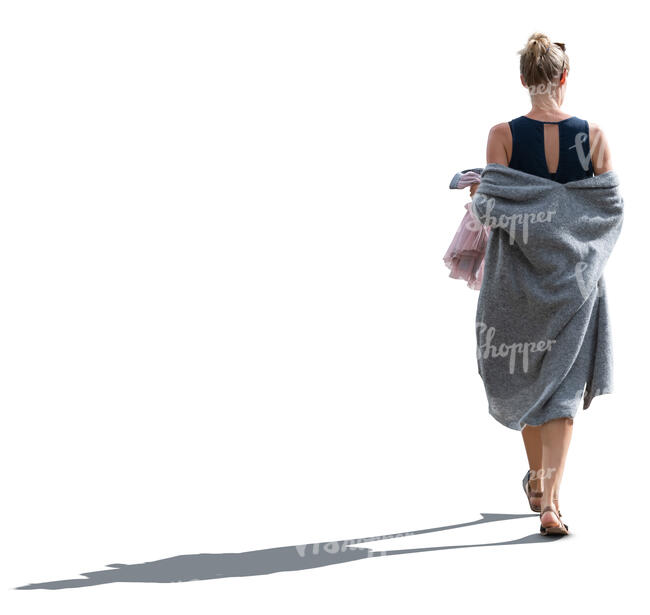 cut out backlit woman with a grey summer overcoat walking