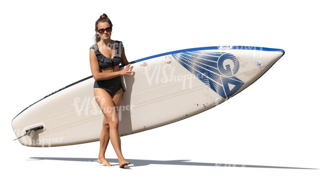 cut out woman with a sup board walking on the beach