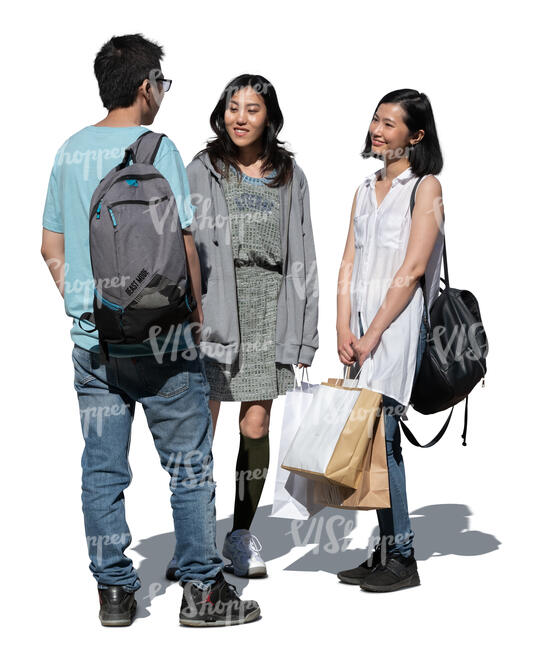 cut out three young asian people with shopping bags standing and talking