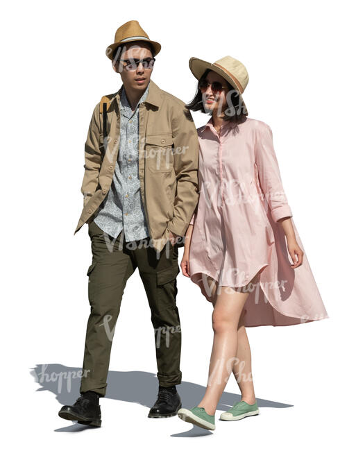 cut out young couple walking arm in arm on a summer day