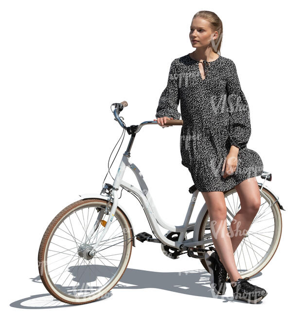 cut out young woman standing and leaning on her bicycle