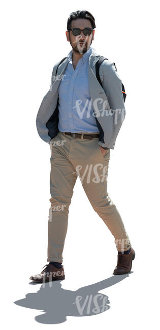 cut out backlit japanese man walking hands in his pockets