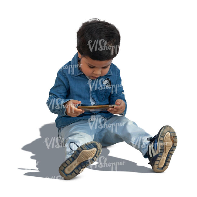 cut out little boy sitting on the ground with a smartphone in his hand